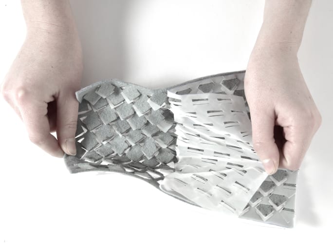 hands tearing fabric apart