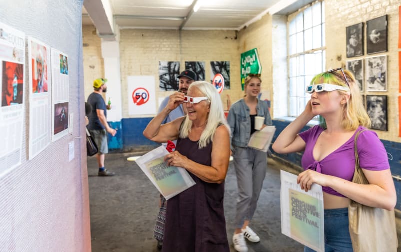 People engaging with artwork at Origins Creative Arts Festival 2019