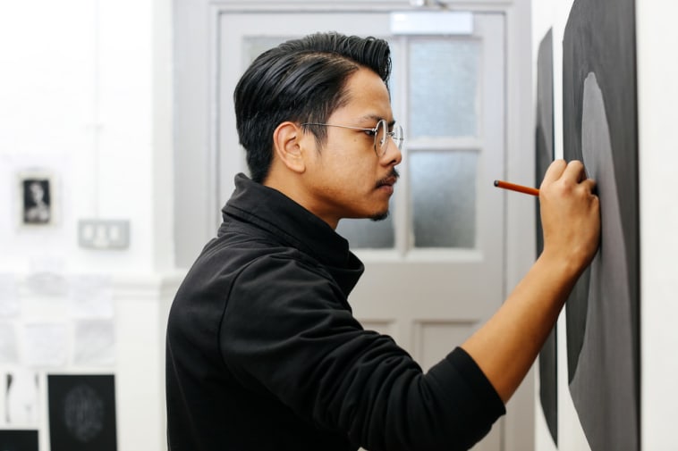 Student drawing in the studio