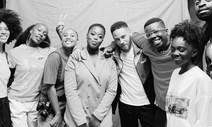 10 people in a photoshoot image in black and white