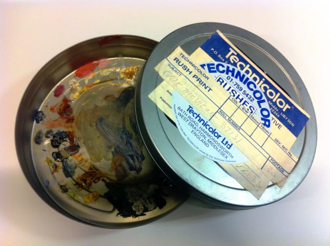 Round 'technicolor rushes' tin, also labelled Erik the Viking, with lid off, coloured paint marks inside tin.