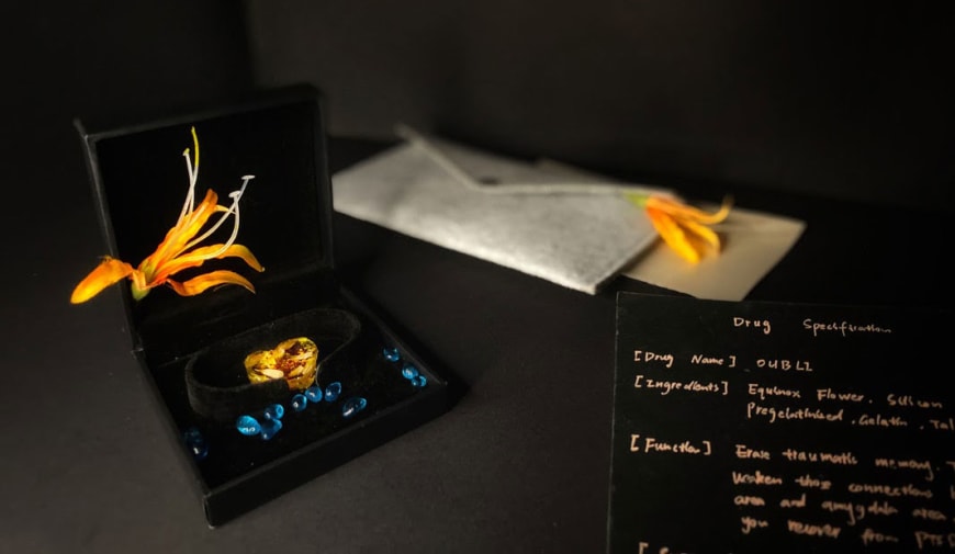 Image depicts a desk filled with papers and ornaments.