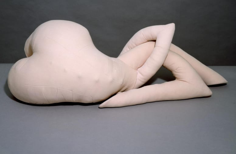 A sculpture of a torso with intertwining arms
