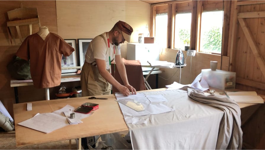 Man in studio creating garments