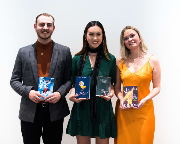 Illustration student Sian McKeever stands with fellow award winners after winning for student design award for Penguin Random House