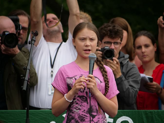 Young activist speaking in front of crowd