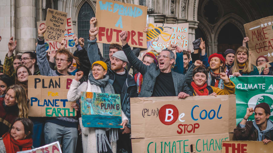 Photo of group of climate protestors holding banners, including 'We demand a future'