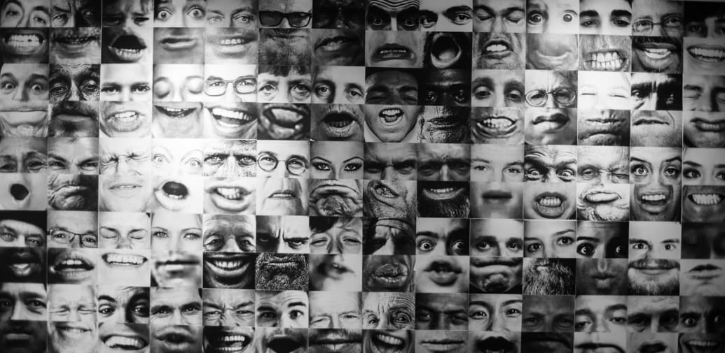A wall of photographs featuring the teeth and mouth of various people.