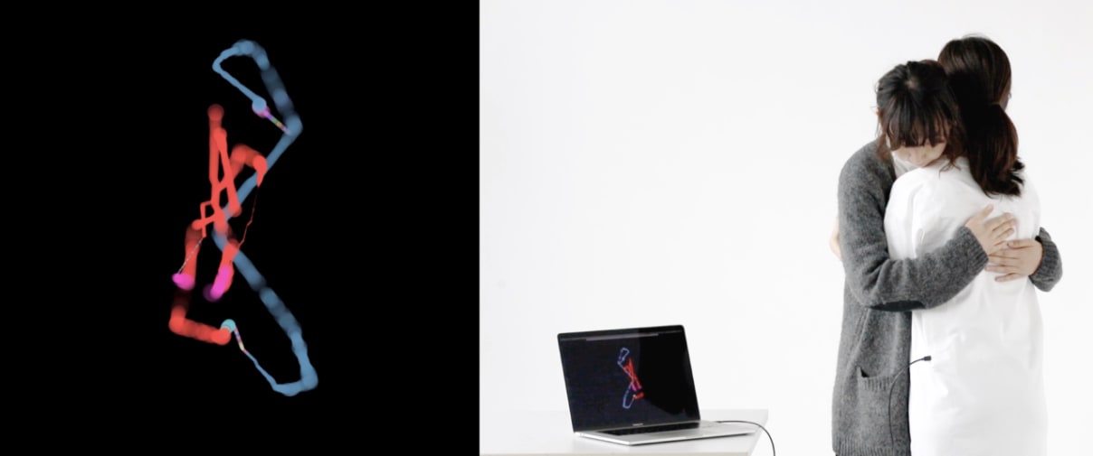 couple embracing in front of digital image