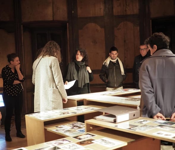 Federica and a group of students around exhibition cabinets
