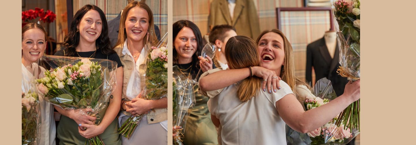 3 Female BA Bespoke Tailoring students with flowers after receiving award