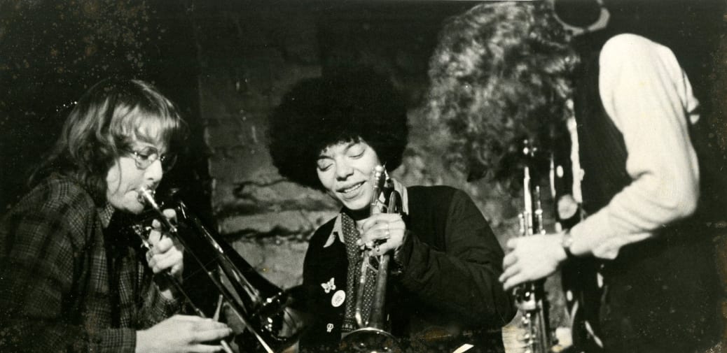 Black and white photograph of three female performers