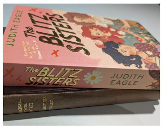 Colour image showing two books piled on a white background. The first is a new book, The Blitz Sisters by Judith Eagle, the one underneath is an historic bound volume of college prospectuses, from the Camberwell College archive.