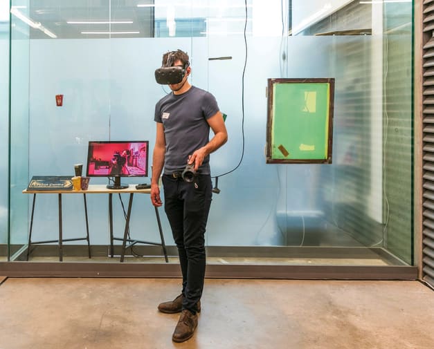 A man wearing a Virtual Reality headset
