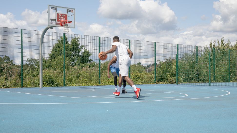 basketball player on blue court