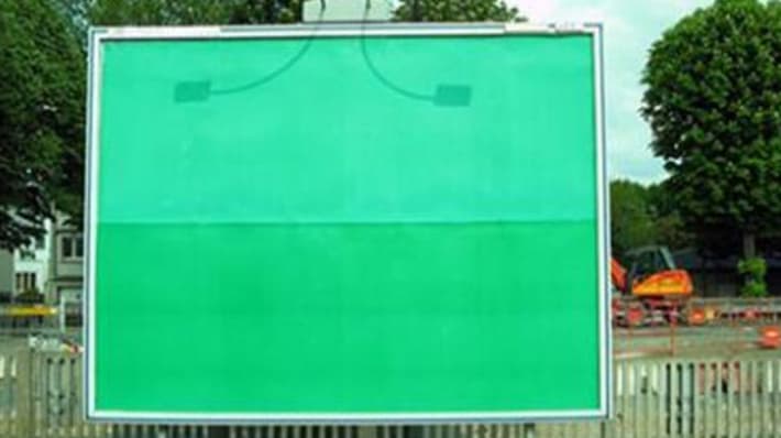 a green placeholder on a billboard