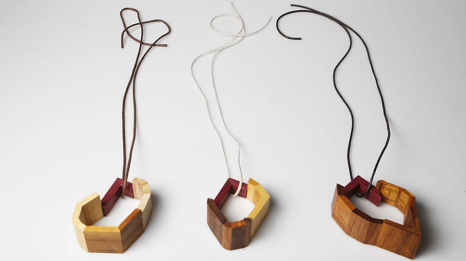 A collection of wooden jewellery pieces