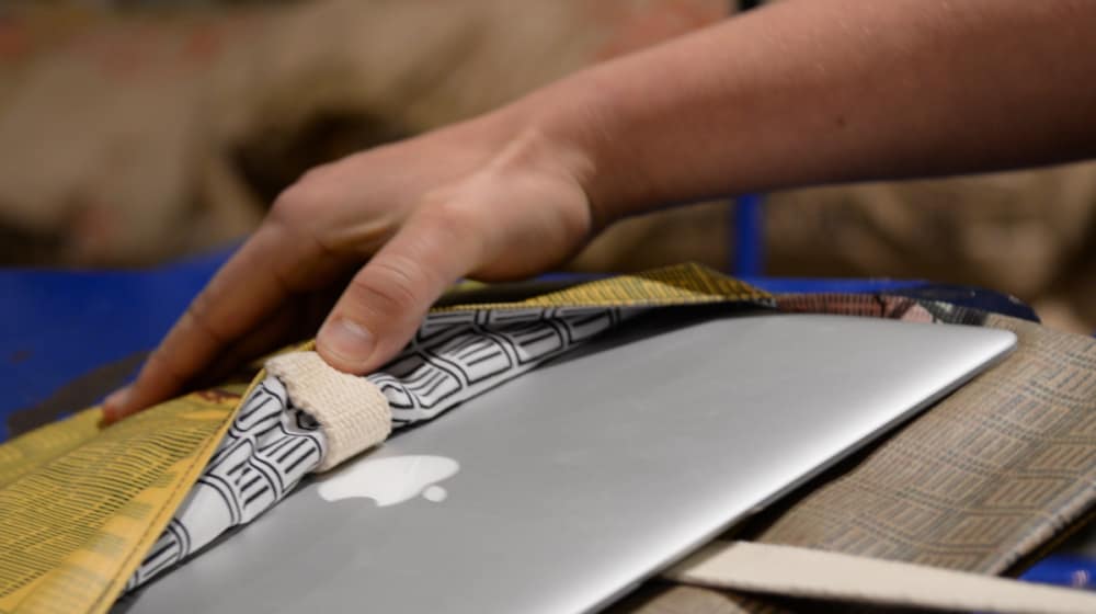 MAC laptop being put in a case