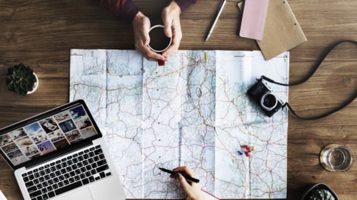 Overview of someone making notes on on a map