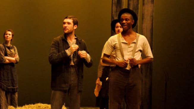 Students in costume doing a performance