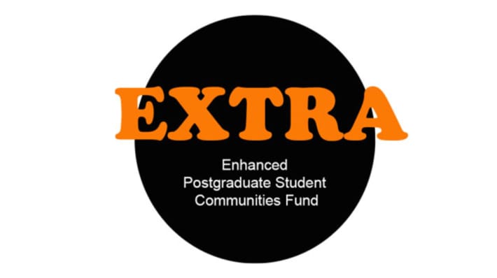 Black circle on white background with EXTRA Enhanced Funding Award written in orange and white text
