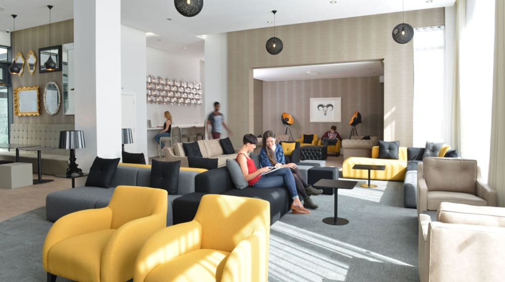 Photo of a communal area with armchairs and tables