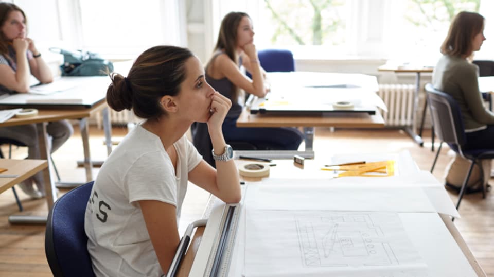 Students sitting at desks in a classroom
