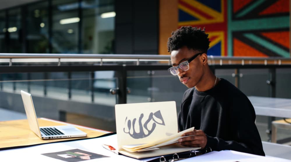Khalil Madovi working in the library