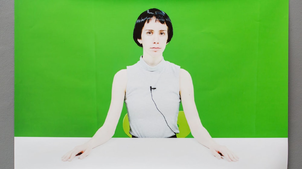 Lady in front of green screen