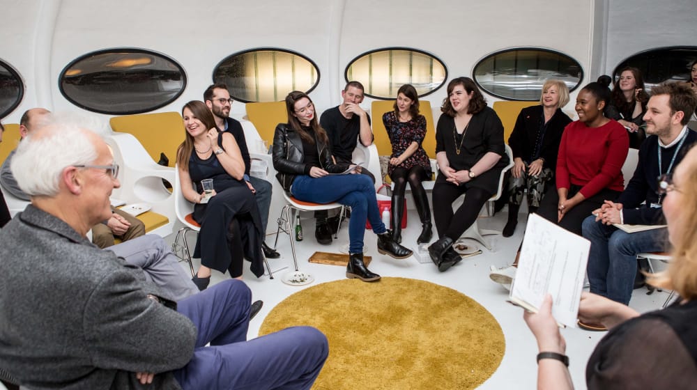 People sitting in a semi-circle