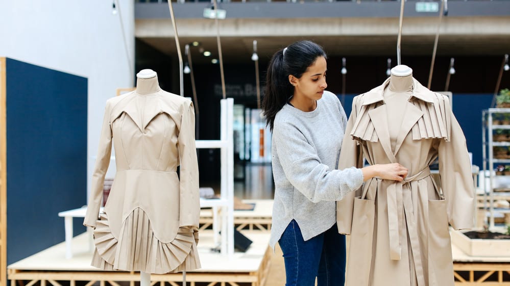 Naila Al-Thani and her 2 fashion design garments without stitches