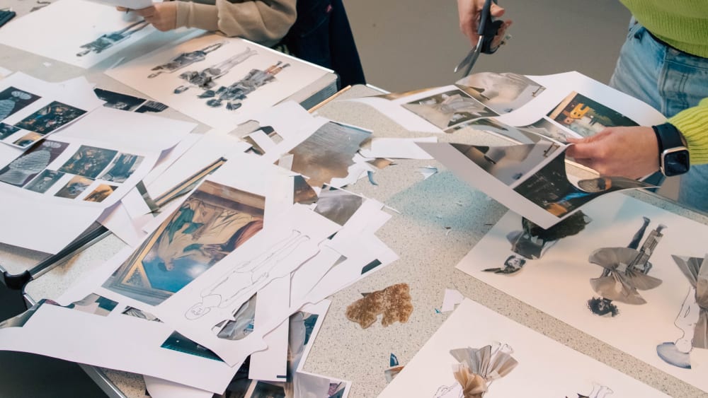 Students cutting illustrations