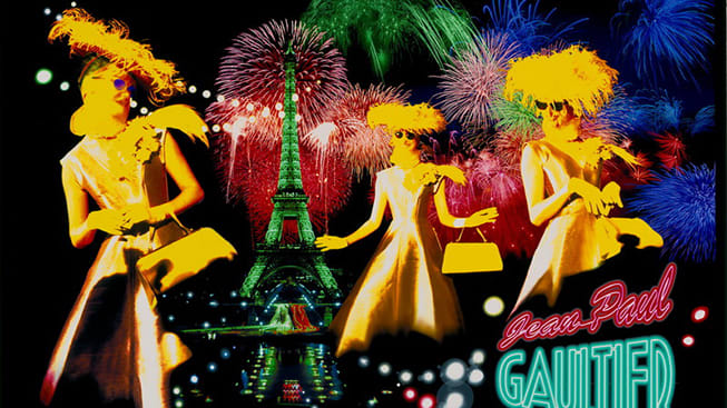 3 models in foreground; Eiffel Tower and fireworks in background