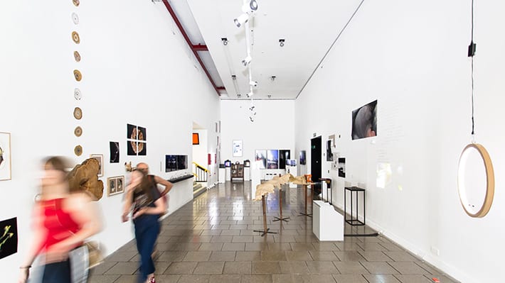 Figures walking through the Atrium Gallery.