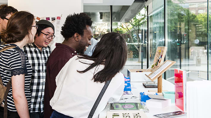 Group of people looking at a display