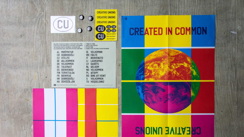 A number of Creative Unions posters laid out on the ground