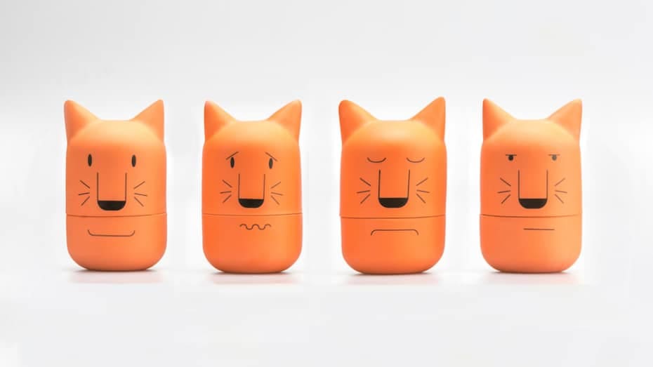 Four orange ceramic cat heads 