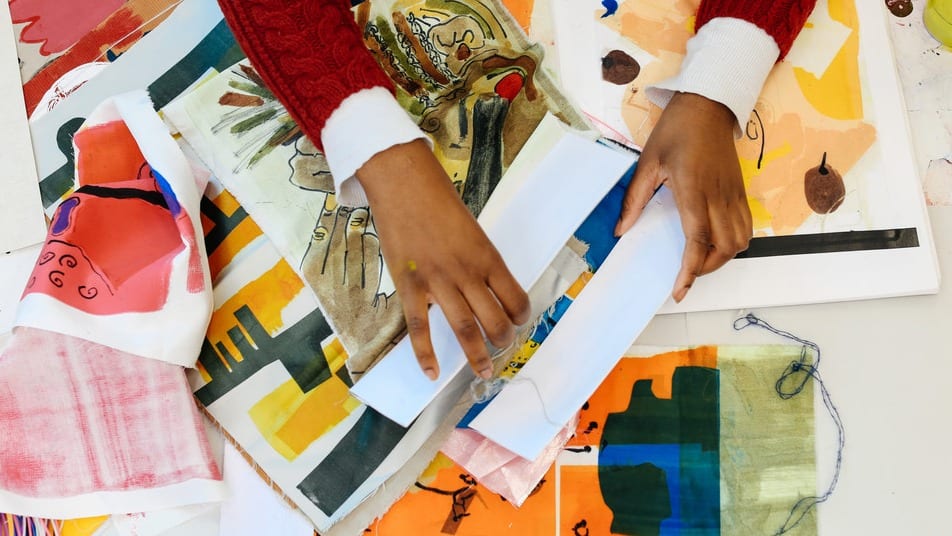 Shot of a student's hands working on a textile project