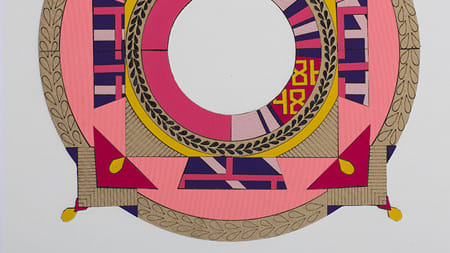 A drawing of a circle with pink, gold, purple and yellow detailing