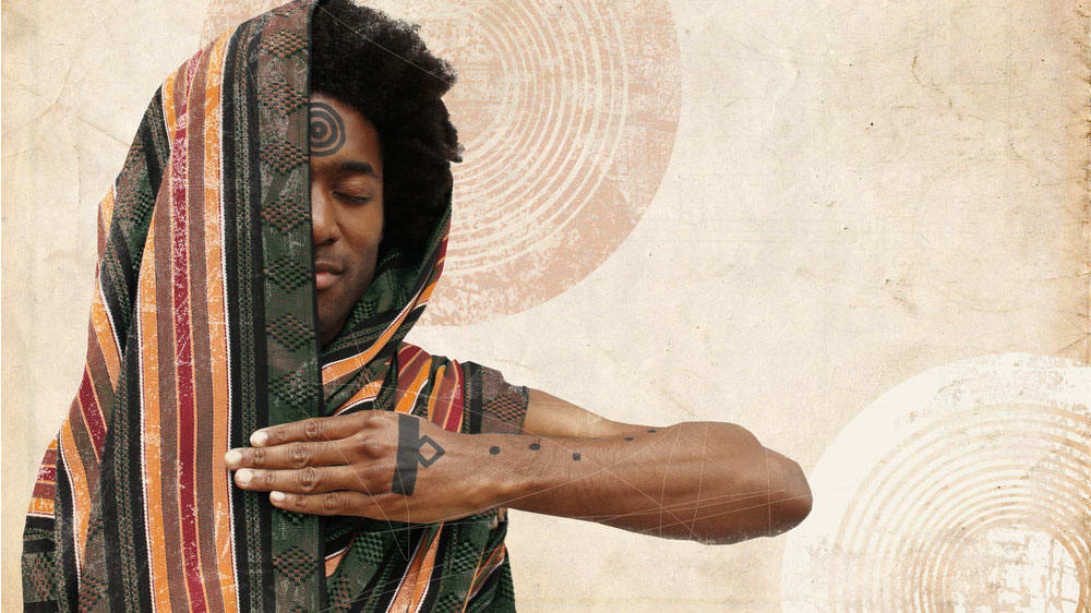 A photograph of a person looking peaceful with their eyes closed and half of their face covered by a garment