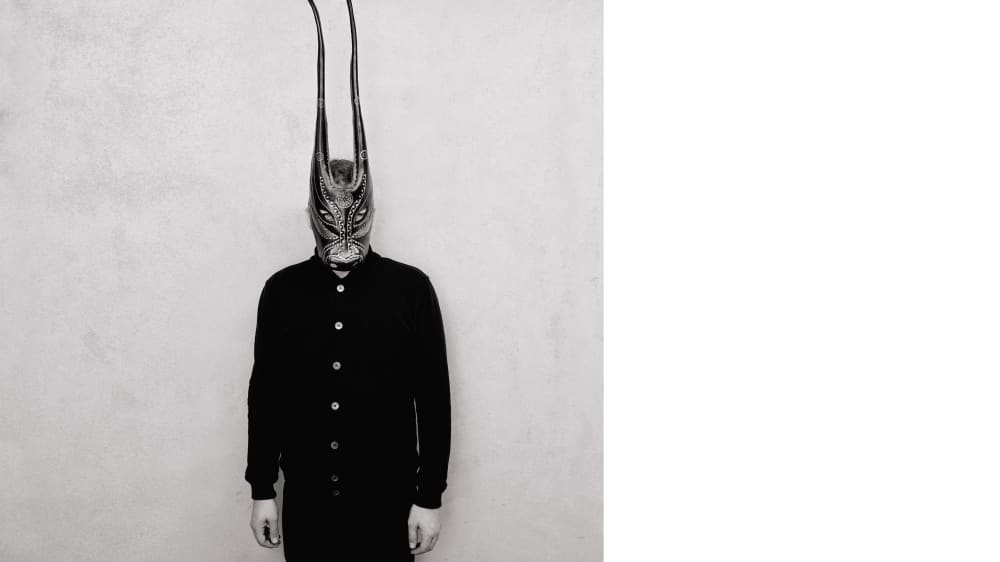 A person wearing a Sardinian bull mask