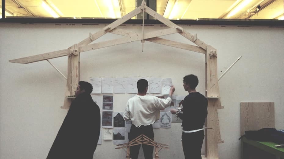 Architecture students set up their work for a final review in the street. 