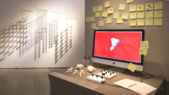 Desktop computer surrounded by post-it notes