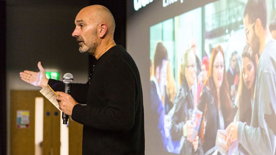 Man presenting to a room.