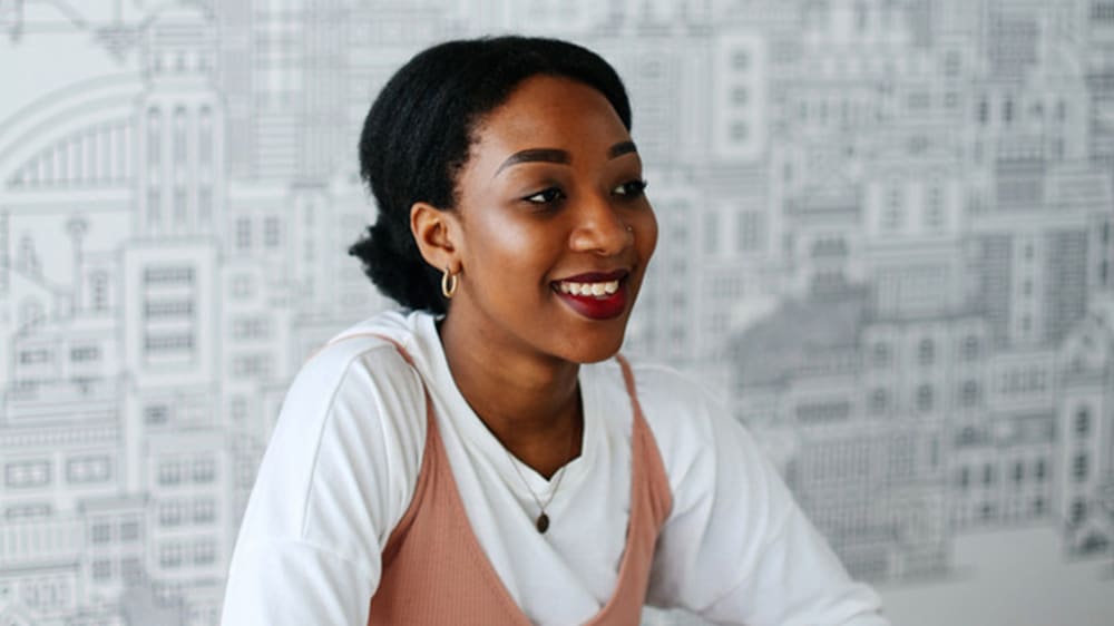 Chenai Nduru sitting at a desk