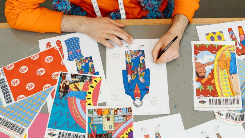 Student working on colourful fashion designs