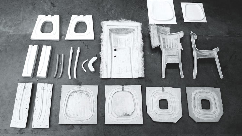 White objects laid out on a dark grey background