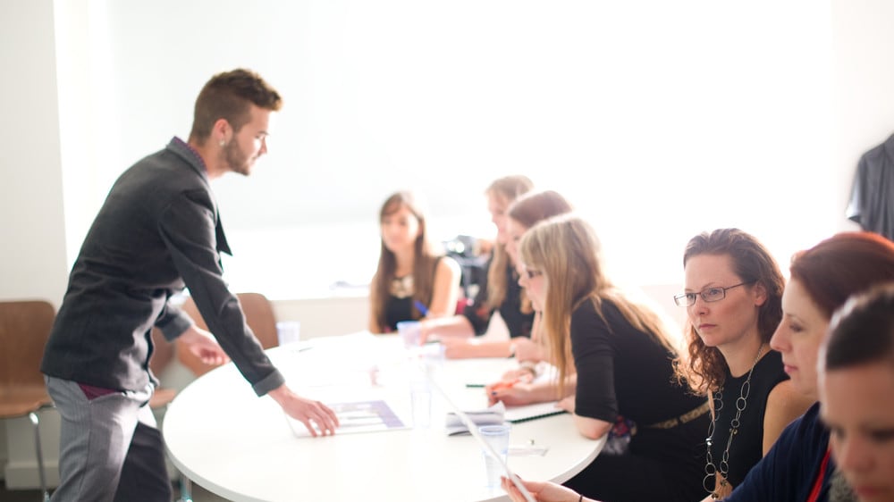 professionals learning from a tutor