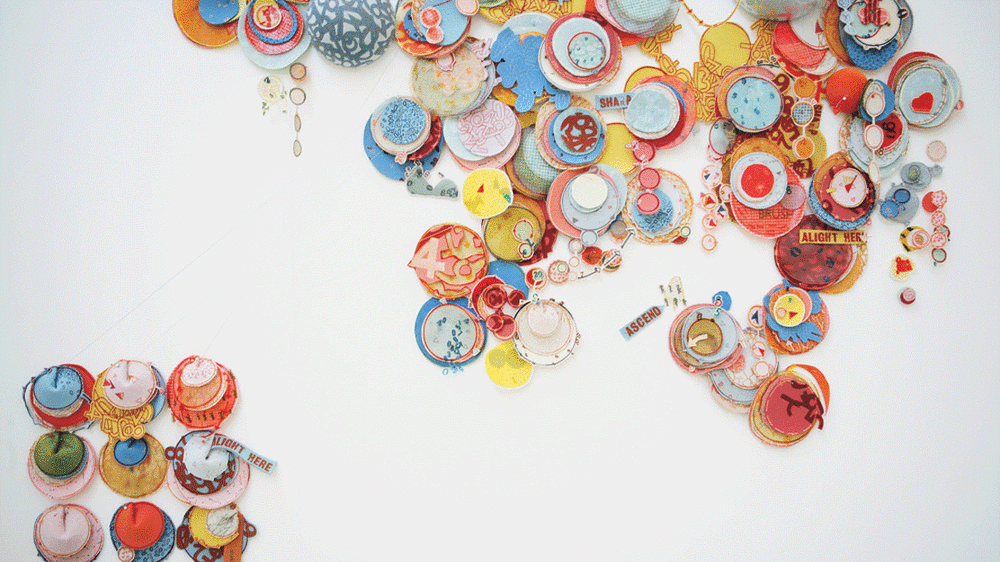Multicoloured disks against a white background