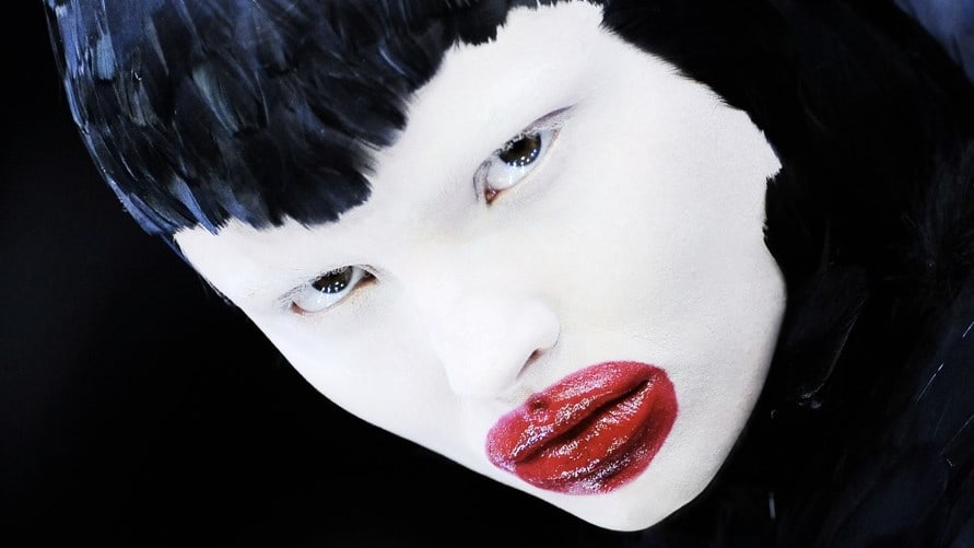 Model with white face red lips